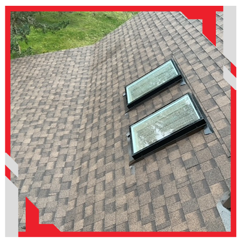 Roofing Contractor in Puyallup, WA inspecting shingles and flashing